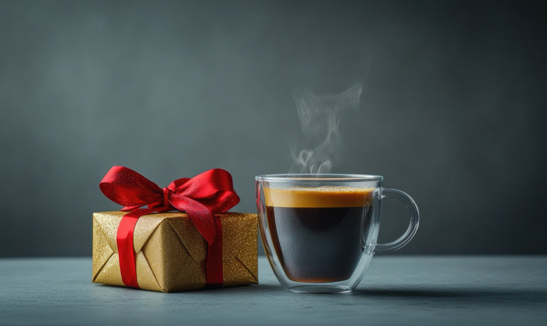 A cup of coffee beside a gold-wrapped gift box — the considered, small-scale gift the right coffee person actually uses