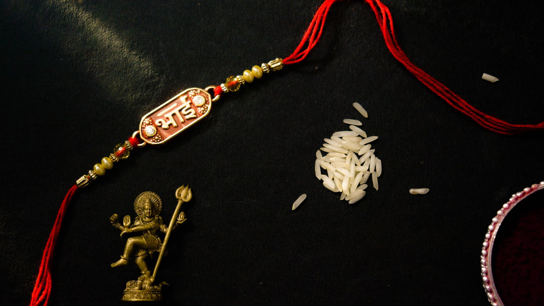 Traditional red rakhi threads with rice and tikka for Raksha Bandhan
