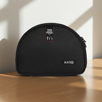 Ginza Tech Pouch in Black on a desk in soft morning light