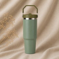 Insulated Travel Mug in Pea Green on natural oatmeal linen