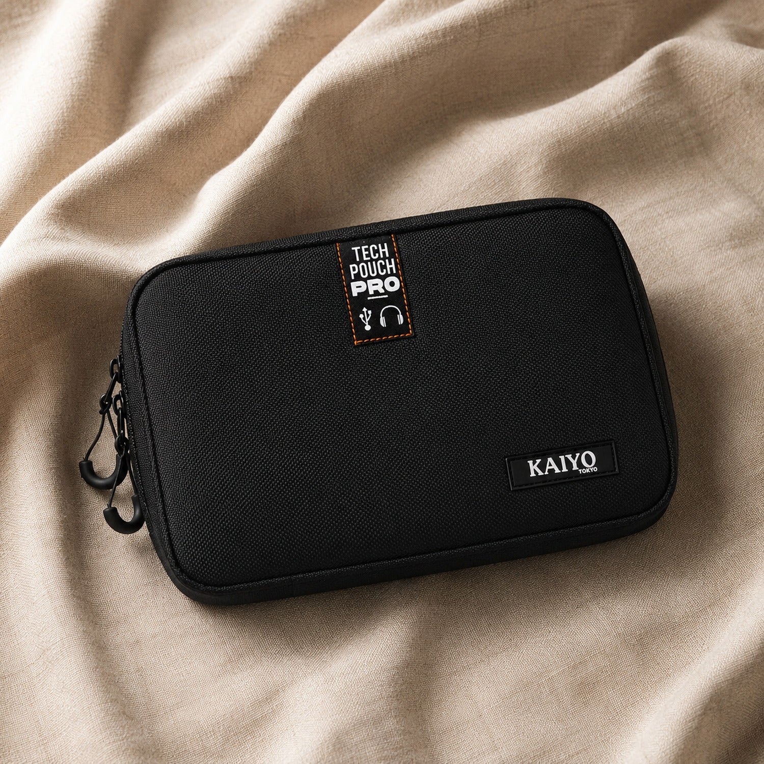 Ginza Tech Pouch Pro resting on natural oatmeal linen