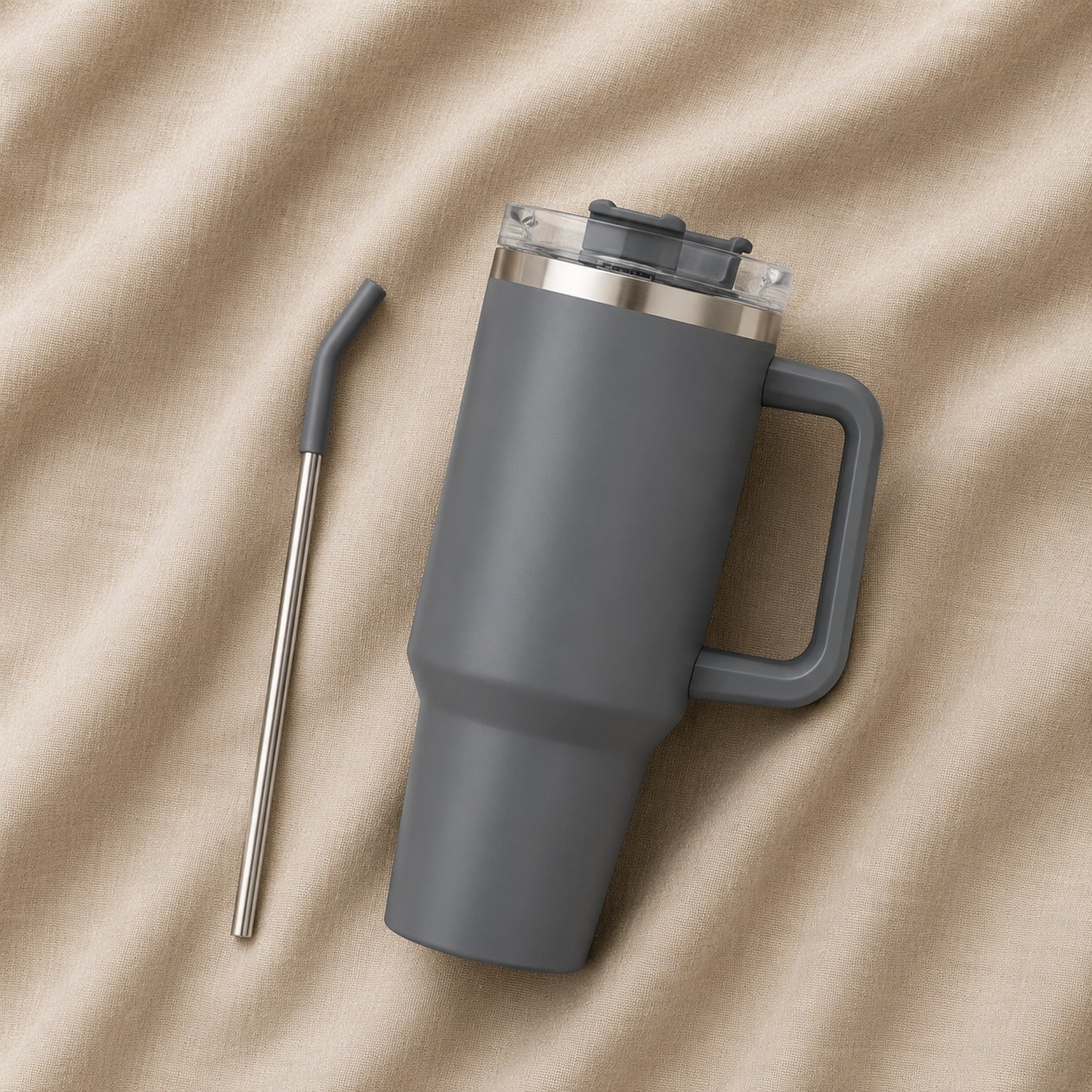 Travel Tumbler 1200ml in Grey resting on natural oatmeal linen