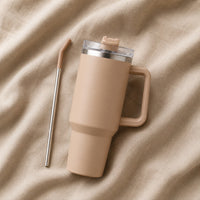 Travel Tumbler 1200ml in Brown resting on natural oatmeal linen