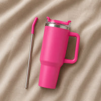 Travel Tumbler 1200ml in Pink resting on natural oatmeal linen