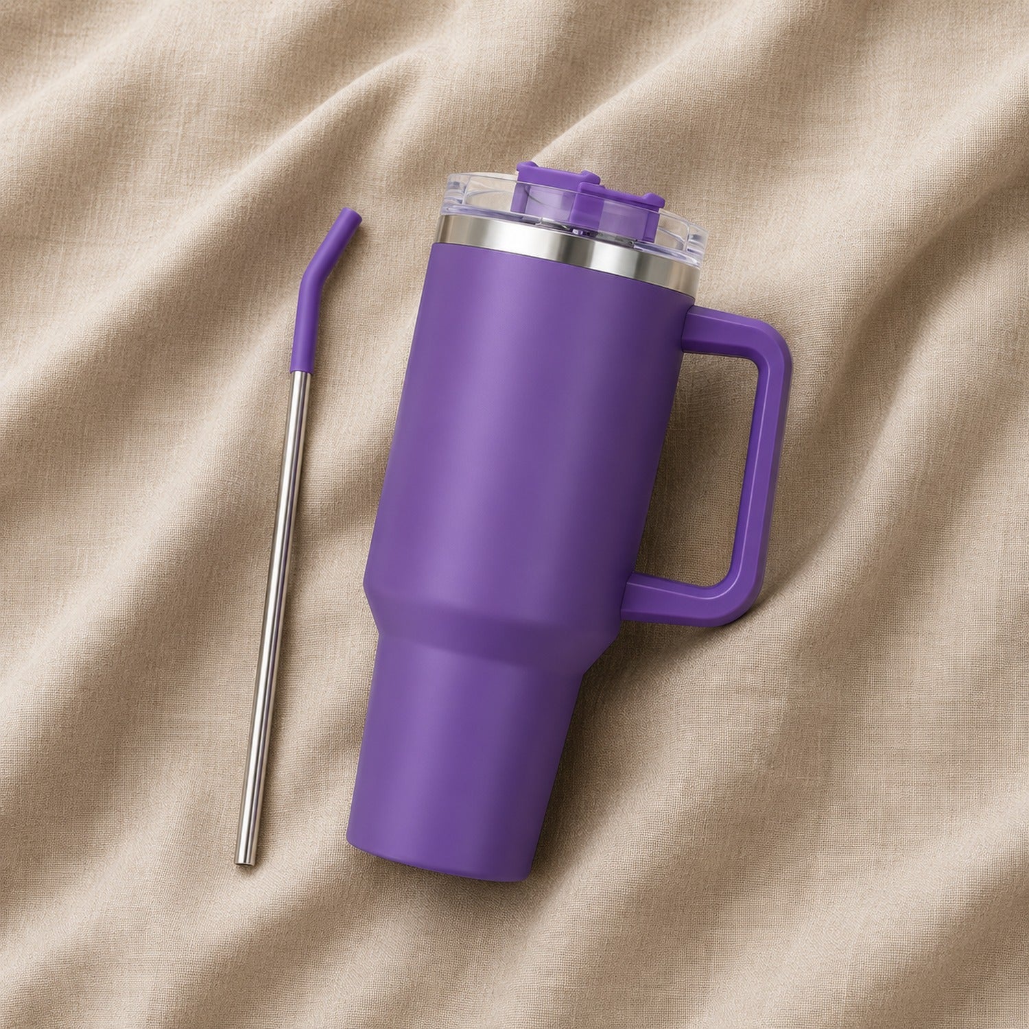 Travel Tumbler 1200ml in Purple resting on natural oatmeal linen